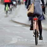 A woman cycling to work.